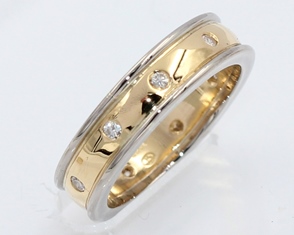 Yellow and white gold flush set diamond band